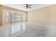 Bright living room with tile floors and a bay window that offers natural light at 5803 Cheshire Cove Ter, Orlando, FL 32829