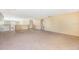 Upstairs loft area with neutral carpet flooring at 5803 Cheshire Cove Ter, Orlando, FL 32829