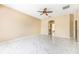 Spacious living room with fan, marble floors, and views of the home's interior at 5803 Cheshire Cove Ter, Orlando, FL 32829