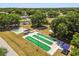 Enjoy lawn bowling on manicured greens alongside basketball courts, surrounded by mature trees at 5962 Sw 98Th Street Rd, Ocala, FL 34476