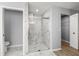 Bathroom with a marble glass door shower and modern fixtures at 5962 Sw 98Th Street Rd, Ocala, FL 34476