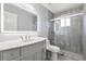 Bathroom featuring marble countertop vanity and tiled glass-enclosed shower at 5962 Sw 98Th Street Rd, Ocala, FL 34476