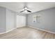 Bedroom with wood-look flooring, ceiling fan and a closet at 5962 Sw 98Th Street Rd, Ocala, FL 34476