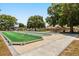Outdoor bocce ball court with manicured green turf, providing a perfect leisure area at 5962 Sw 98Th Street Rd, Ocala, FL 34476