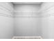 Walk-in closet with white wire shelving system, perfect for organization at 5962 Sw 98Th Street Rd, Ocala, FL 34476