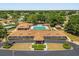 An aerial view of the community center, pool, pavilion, and tennis courts at 5962 Sw 98Th Street Rd, Ocala, FL 34476