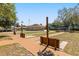 Outdoor shuffleboard courts are surrounded by lush landscaping and walkways in this active community at 5962 Sw 98Th Street Rd, Ocala, FL 34476