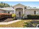 Inviting front entrance with well-maintained landscaping and covered porch at 5962 Sw 98Th Street Rd, Ocala, FL 34476
