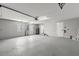 Spacious garage features a utility sink, water heater, and ample room for parking and storage at 5962 Sw 98Th Street Rd, Ocala, FL 34476