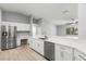 Spacious kitchen showcases a breakfast bar, stainless appliances, and custom cabinetry at 5962 Sw 98Th Street Rd, Ocala, FL 34476