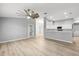 Open-concept living room with modern finishes and a view of the kitchen at 5962 Sw 98Th Street Rd, Ocala, FL 34476