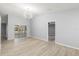 Bright living room showcasing modern lighting, new flooring, and seamless access to the outdoors at 5962 Sw 98Th Street Rd, Ocala, FL 34476