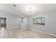 Bright living room with new floors, modern lighting, and a large window at 5962 Sw 98Th Street Rd, Ocala, FL 34476