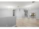 Large living room featuring new flooring, high ceilings, and stylish light fixtures at 5962 Sw 98Th Street Rd, Ocala, FL 34476