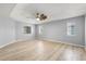 Bright main bedroom featuring a ceiling fan, natural light, and neutral tones at 5962 Sw 98Th Street Rd, Ocala, FL 34476