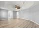 Spacious main bedroom with a tray ceiling, ceiling fan, and walk-in closet at 5962 Sw 98Th Street Rd, Ocala, FL 34476