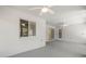 The outdoor patio includes ceiling fans for comfort and a sliding door for easy access to the indoors at 5962 Sw 98Th Street Rd, Ocala, FL 34476