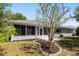 Relaxing screened-in porch offers a peaceful view of the surrounding yard at 5962 Sw 98Th Street Rd, Ocala, FL 34476