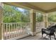 Relaxing balcony offering serene views of lush greenery and the neighborhood at 7130 Forty Banks Rd, Harmony, FL 34773