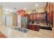Bright kitchen showcasing granite countertops, stainless steel appliances, and backsplash at 7130 Forty Banks Rd, Harmony, FL 34773