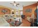 Spacious living room with arched openings into the kitchen and dining areas at 7130 Forty Banks Rd, Harmony, FL 34773
