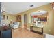 Open-concept living area with views of the staircase and adjacent dining room at 7130 Forty Banks Rd, Harmony, FL 34773
