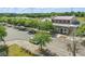 A charming street view showcasing businesses and well-maintained sidewalks lined with lush, mature trees at 7130 Forty Banks Rd, Harmony, FL 34773