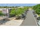 A charming street view showcasing businesses and sidewalks shaded by lush, mature trees on a clear day at 7130 Forty Banks Rd, Harmony, FL 34773