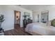 The main bedroom boasts hardwood floors and an ensuite bathroom and walk-in closet at 8355 Madrid St, Lakeland, FL 33810