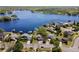 Beautiful aerial shot highlights the lakefront home with lush landscaping, docks, and serene water access at 8616 Port Said St, Orlando, FL 32817