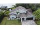 Stunning lake view home with a pristine lawn, two-car garage, and beautiful landscaping at 8616 Port Said St, Orlando, FL 32817