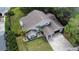 A stunning gray home with a gorgeous walkway and landscaping, plus a two-car garage at 8616 Port Said St, Orlando, FL 32817