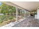 Covered back patio overlooking a large green backyard at 8616 Port Said St, Orlando, FL 32817