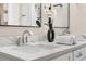 Close-up of bathroom with double sinks and granite counters at 8616 Port Said St, Orlando, FL 32817
