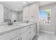 Modern bathroom with double vanity, marble countertops, and stylish fixtures for a luxurious feel at 8616 Port Said St, Orlando, FL 32817