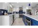 Modern kitchen with white cabinets, stainless steel appliances, and blue subway tile backsplash at 8616 Port Said St, Orlando, FL 32817
