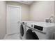 This laundry room has a new washer and dryer at 8616 Port Said St, Orlando, FL 32817