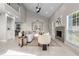 Light-filled living room with modern fireplace, high ceilings, and comfortable seating at 8616 Port Said St, Orlando, FL 32817