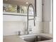 Outdoor sink with modern, brushed-steel faucet at 8616 Port Said St, Orlando, FL 32817
