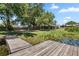 Stunning lake view from the dock, surrounded by lush greenery and serene waters, perfect for water activities at 8616 Port Said St, Orlando, FL 32817