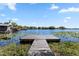 Scenic view from the dock, overlooking a serene lake with lush greenery, ideal for nature lovers and water enthusiasts at 8616 Port Said St, Orlando, FL 32817