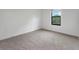 Bedroom featuring plush carpet and a window to let natural light in at 8802 Positivity Dr, Kissimmee, FL 34747
