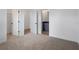 Bedroom showcasing doors to the walk-in closet and bathroom, neutral carpet and decor at 8802 Positivity Dr, Kissimmee, FL 34747