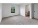 Bedroom featuring plush carpet, a window, and a bathroom at 8802 Positivity Dr, Kissimmee, FL 34747