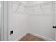 Walk-in closet with wire shelving and carpet flooring at 8802 Positivity Dr, Kissimmee, FL 34747