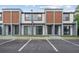 Modern townhomes feature a neutral color palette, sleek lines, and reserved parking at 8802 Positivity Dr, Kissimmee, FL 34747
