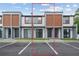 Modern townhomes feature a neutral color palette, sleek lines, and reserved parking at 8802 Positivity Dr, Kissimmee, FL 34747
