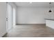Bright, open living space with sliding glass doors and modern light gray flooring at 8802 Positivity Dr, Kissimmee, FL 34747