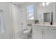 Bright bathroom featuring a tub, shower, and sleek modern vanity and fixtures at 9250 Neher St, Orlando, FL 32827