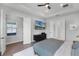 Serene bedroom featuring a TV, modern furniture, and an ensuite bathroom at 9250 Neher St, Orlando, FL 32827